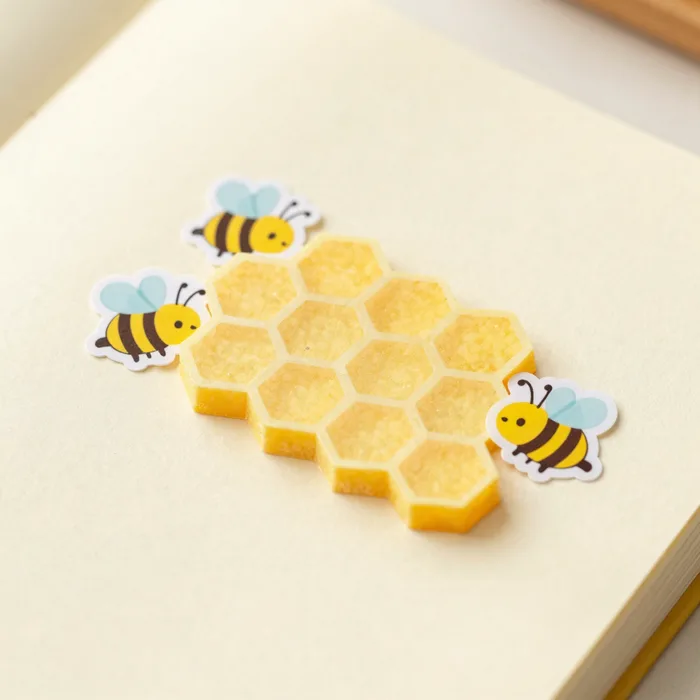 A playful counting game with a honeycomb and cartoon bees, sunny yellows